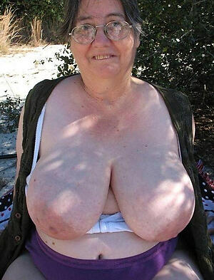 horny big busty granny poses naked